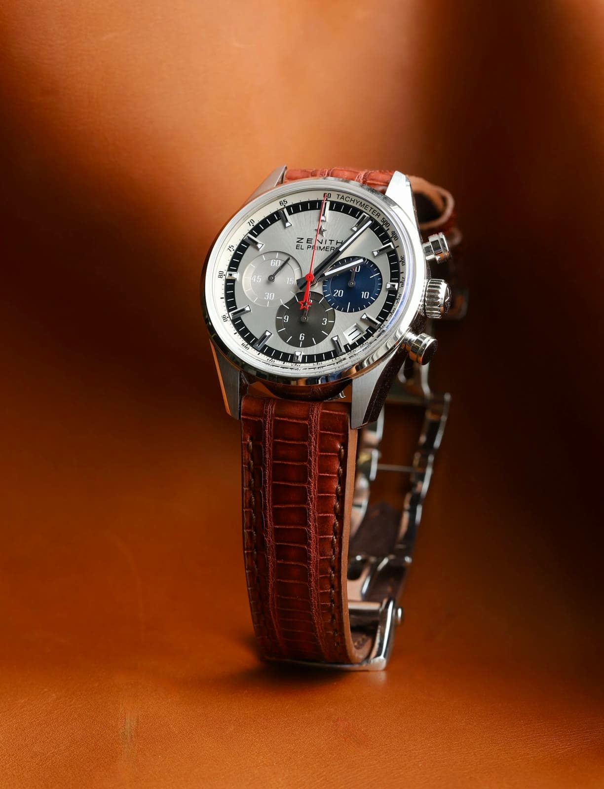 A Zenith El Primero on a brown alligator strap with cleanly burnished edges.