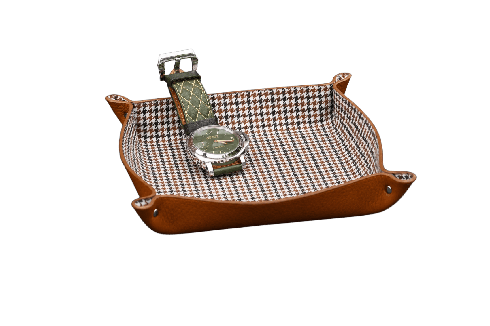 A tan leather Aaron Bespoke valet tray with houndstooth lining holding a Panerai Luminor.